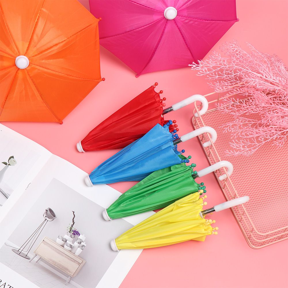 Neue Stil Bunte Kunststoff Mini Regenschirm Regen Getriebe Spielzeug Regenschirm Baby Spielzeug Mädchen Puppe Verschönerung Puppe Kleidung Dekoration
