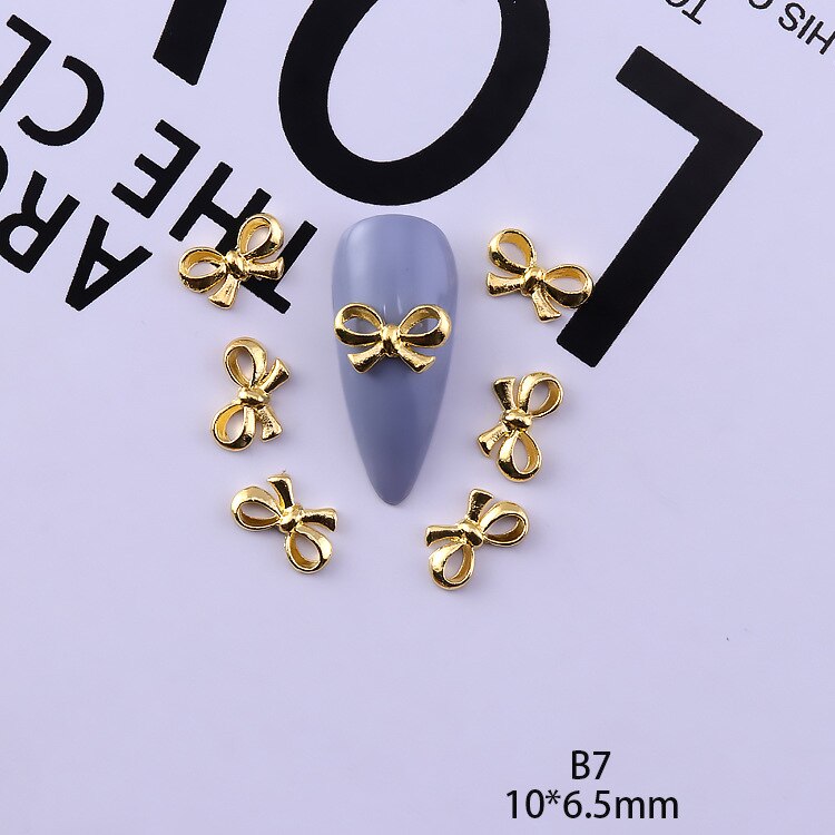 50 pezzi di ciondoli in lega d'oro e d'argento per unghie papillon farfalla 3D multi-forme accessori per unghie per ciondoli gioielli per chiodo arte giapponesi: verde