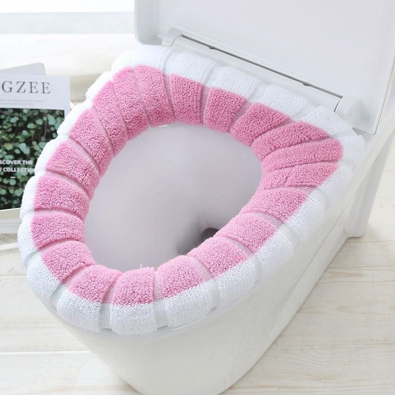 La couverture confortable de siège de toilette est des articles sanitaires chauds, doux et réutilisables de flanelle: Pink white