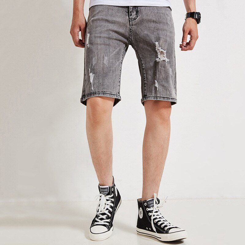 Pantalones cortos de mezclilla para hombre nuevos pantalones cortos de cinco puntos coreanos casuales de tiro medio sueltos elásticos rizados tamaño 28-35 36