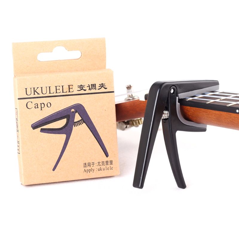 cejilla de Ukelele 4 cuerdas Capos de guitarra solo cambio rápido Ukelele Capo guitarra piezas y accesorios