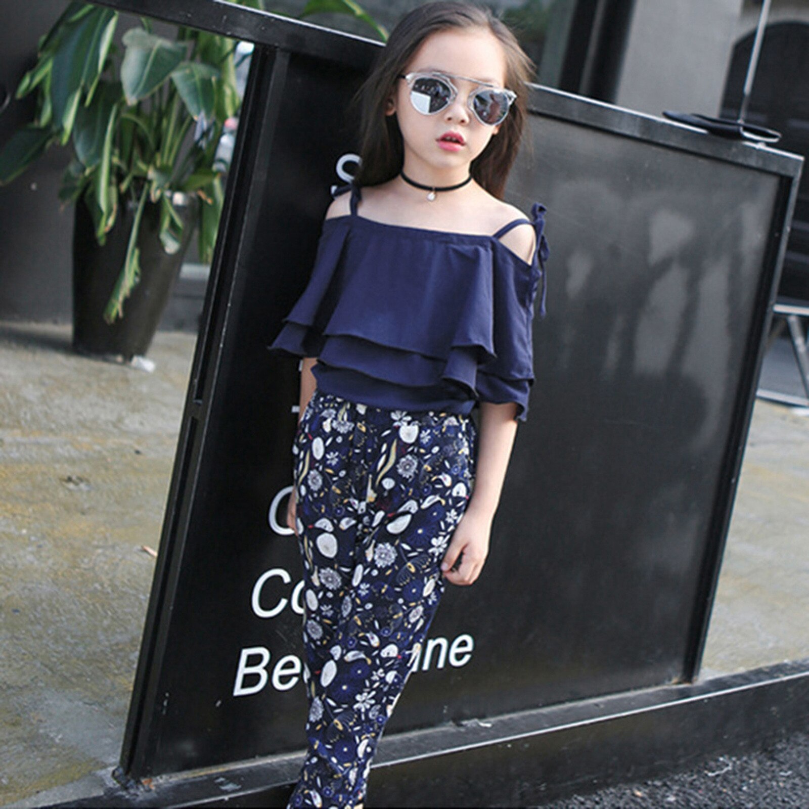 Moda bambini ragazza abbigliamento estate spalla aperta Sling Ruffle T-Shirt top + pantaloni floreali Set elegante per abiti da ragazza grande adolescente