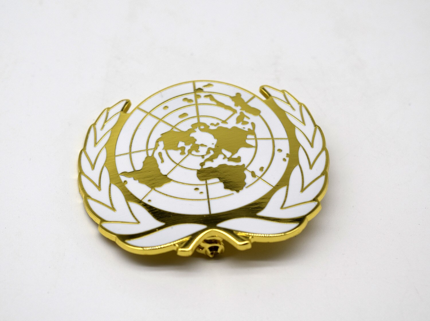 United Nations Peacekeeping Force UN BLUE BERET Hat Badge UN Gold Badge