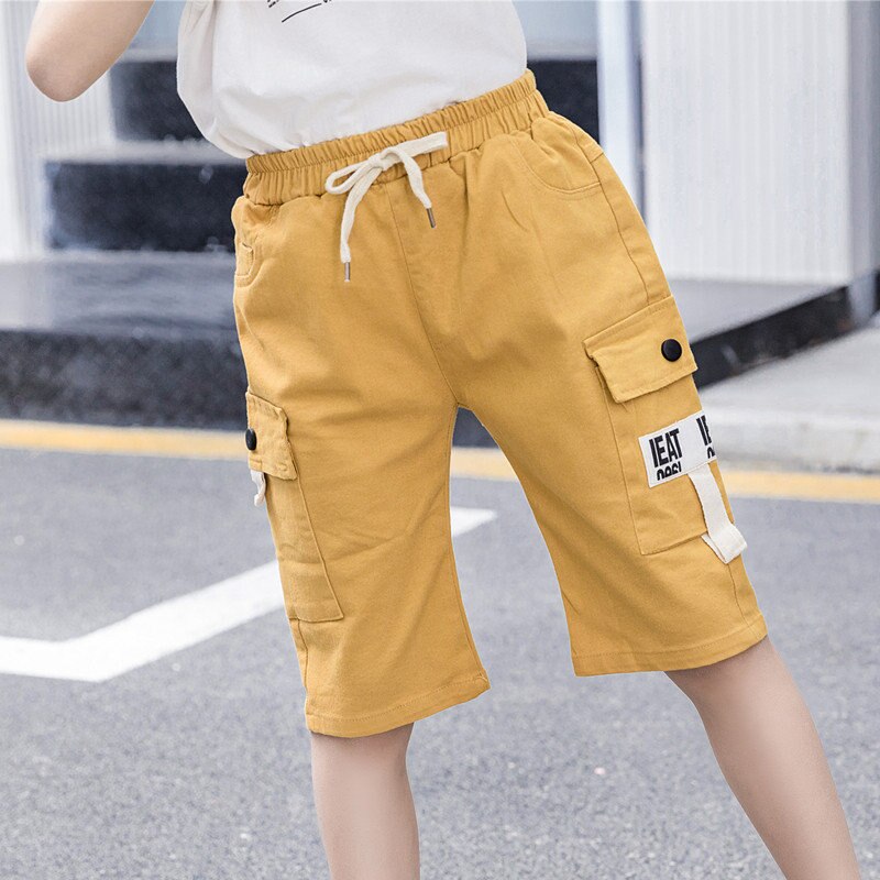 Sommar barns fritidsshorts pojkar flickor enfärgad resår i midjan korta byxor unisex barn strandshorts för 5-13 år: Gul / 9