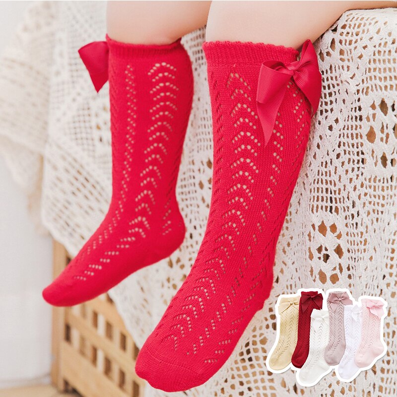 Chaussettes mignonnes pour bébés filles, chaussettes respirantes à trous pour enfants, chaussettes hautes à nœud papillon, chaussettes de sol longues de couleur unie pour nourrissons