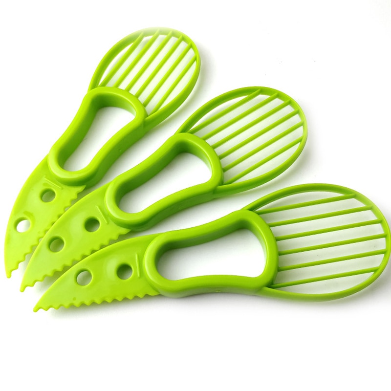 Krajalnica robić awokado obieraczka robić cięcia dzieli owoce doły szufelka narzędzia kuchenne Zielony