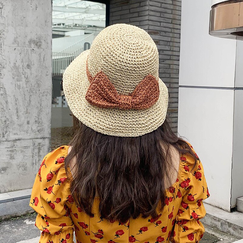 Japansk stråhatt kvinnlig sommarhit färg rosett knut handgjord halm ihålig fiskarhatt strandsolskydd hatt hinkhatt