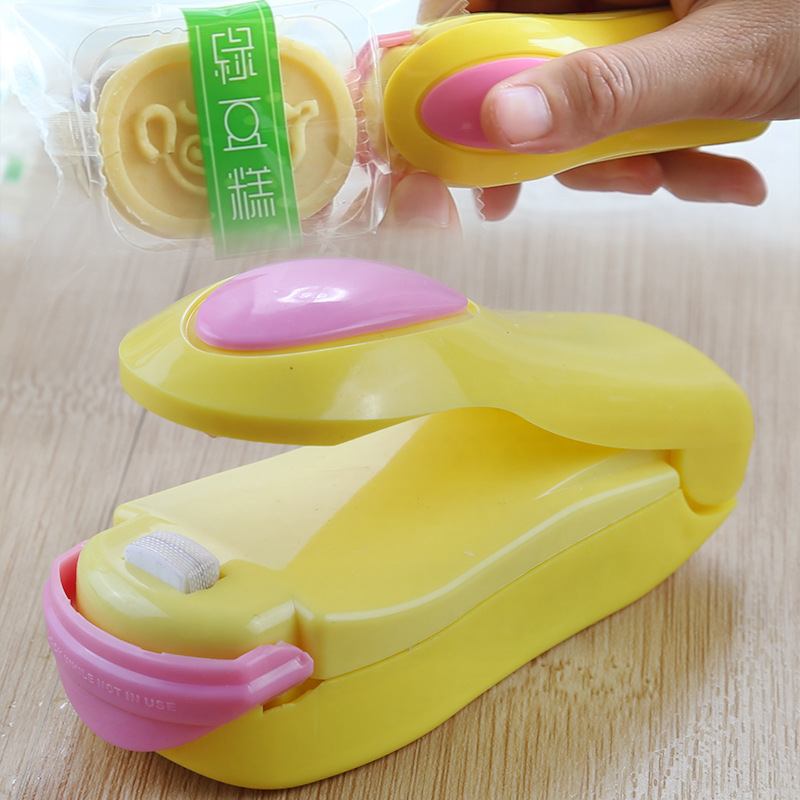 Bärbar hushålls mini förseglingsmaskin mat plastpåse resor hand tryck förseglingsmaskin pulsförsegling förseglingspaket