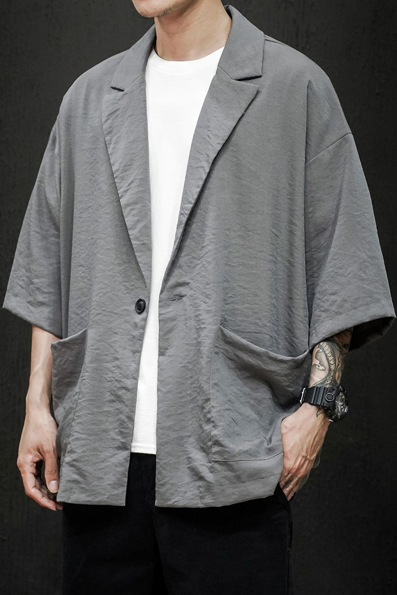 Lente en zomer jeugd populaire heren losse effen kleur zeven punt mouw pak casual dunne jas jas