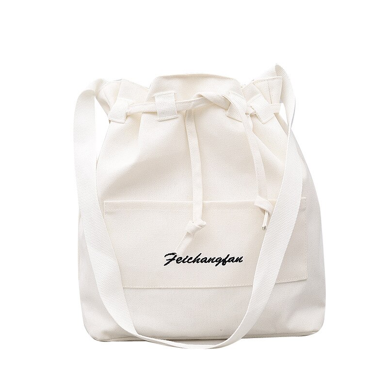 Nian lente en zomer koreaanse versie van de eenvoudige emmer canvas tas schouder laptop bulk tas messenger vrouw: Wit