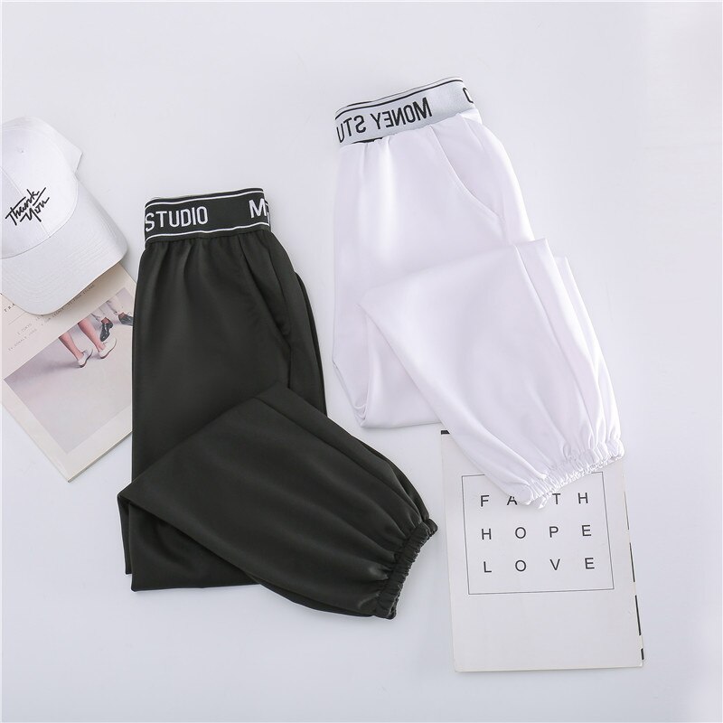 Sportbroek dames lente en herfst losse balk voeten zwarte koreaanse casual negenpuntsbroek