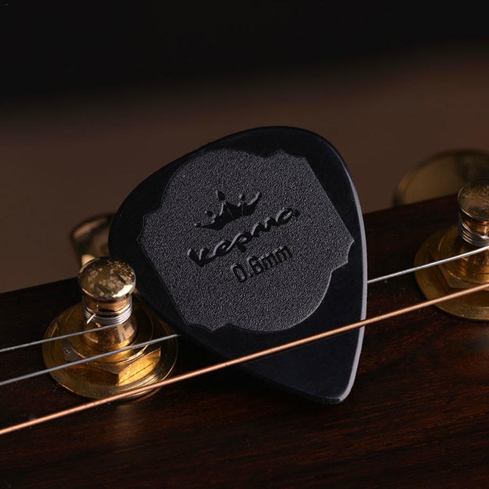 Púa de Guitarra antideslizante, 5 uds., mediador de nailon blanco y negro para Guitarra eléctrica acústica, ukelele de 0,6 MM, accesorios