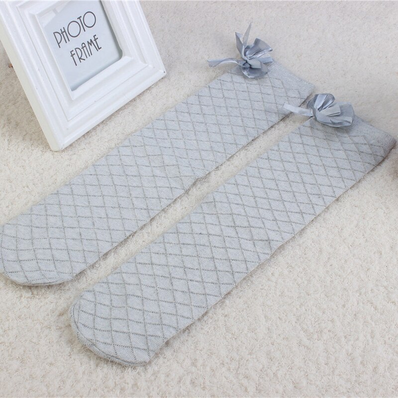 Dziewczęce skarpetki kolana wysoko nad Bowknot styl w kratę dzieci przyczynowe elastyczne skarpety jednolite kolory dla 3-12 lat dziewczyny kolanówki