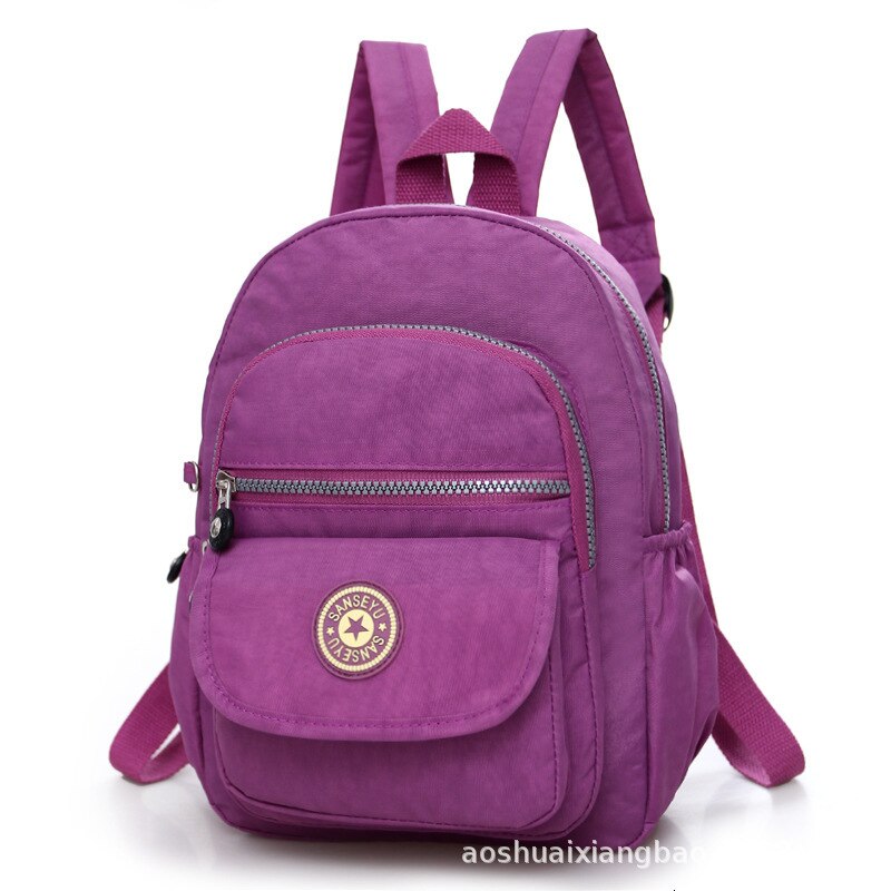 Mochila escolar informal de nailon para mujer, Mochila pequeña e impermeable, bolso de hombro, bolso de mano de capacidad Simple, mochila para chicas: light purple