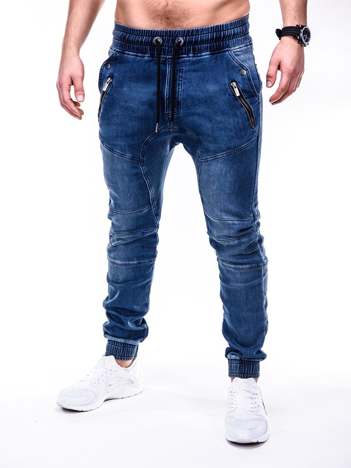 Höstens europeiska och amerikanska tvättade denimtyg för män sportbyxor och benvärmande jeans
