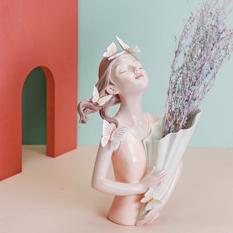 Kreatywna skandynawska moda motyl dziewczyna trzyma kwiat kwiat z żywicy kwiatek doniczkowy układ wazon suszony kwiat kwiat sztuka miękki deco