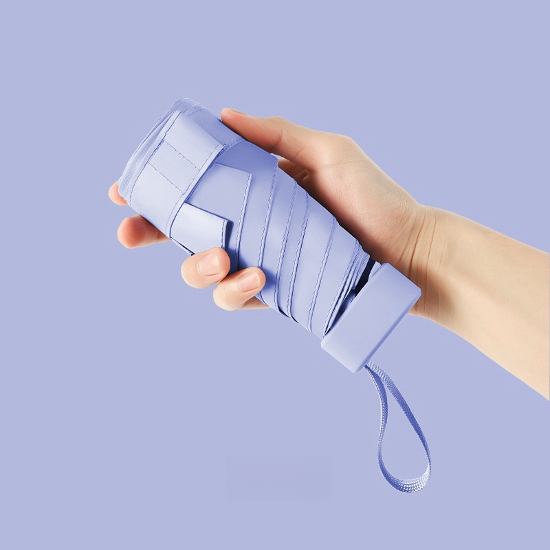 Paraguas de cápsula portátil Mini sombrilla protector solar paraguas de lluvia mango de aleación de caucho negro plegable sol lluvia doble uso cápsula Umb: Morado