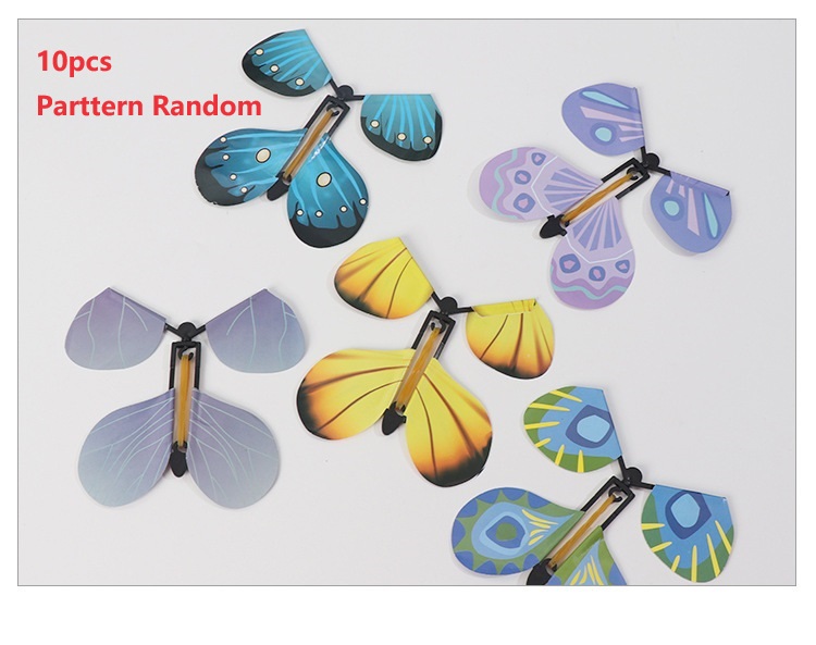 Mariposas voladoras mágicas, juguete de cuerda en el cielo, marcapáginas, tarjetas de felicitación, banda de goma alimentada, accesorios mágicos para niños, sorpresa: plum