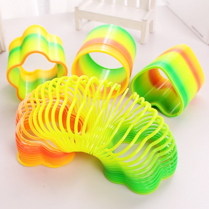 estilo 4-Kind forma arco iris anillo juguetes educativos para niños Arco Iris mágico anillo de juguete de gran venta