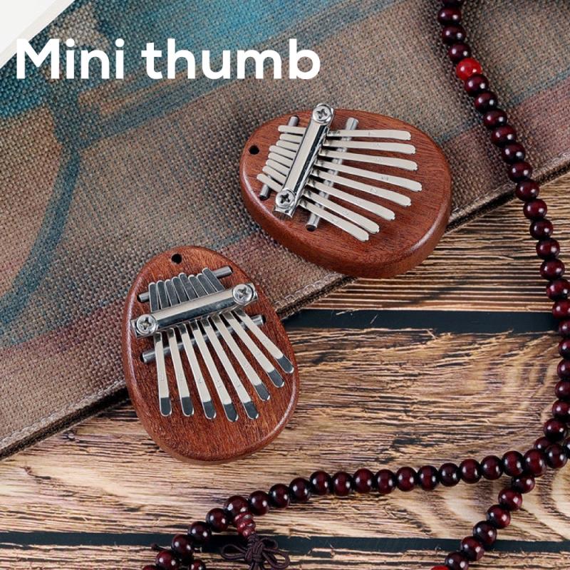 2021 Hot 8 Key Mini Kalimba Finger squisito pollice pianoforte musicale Marimba strumento musicale in legno acrilico ciondolo buon regalo