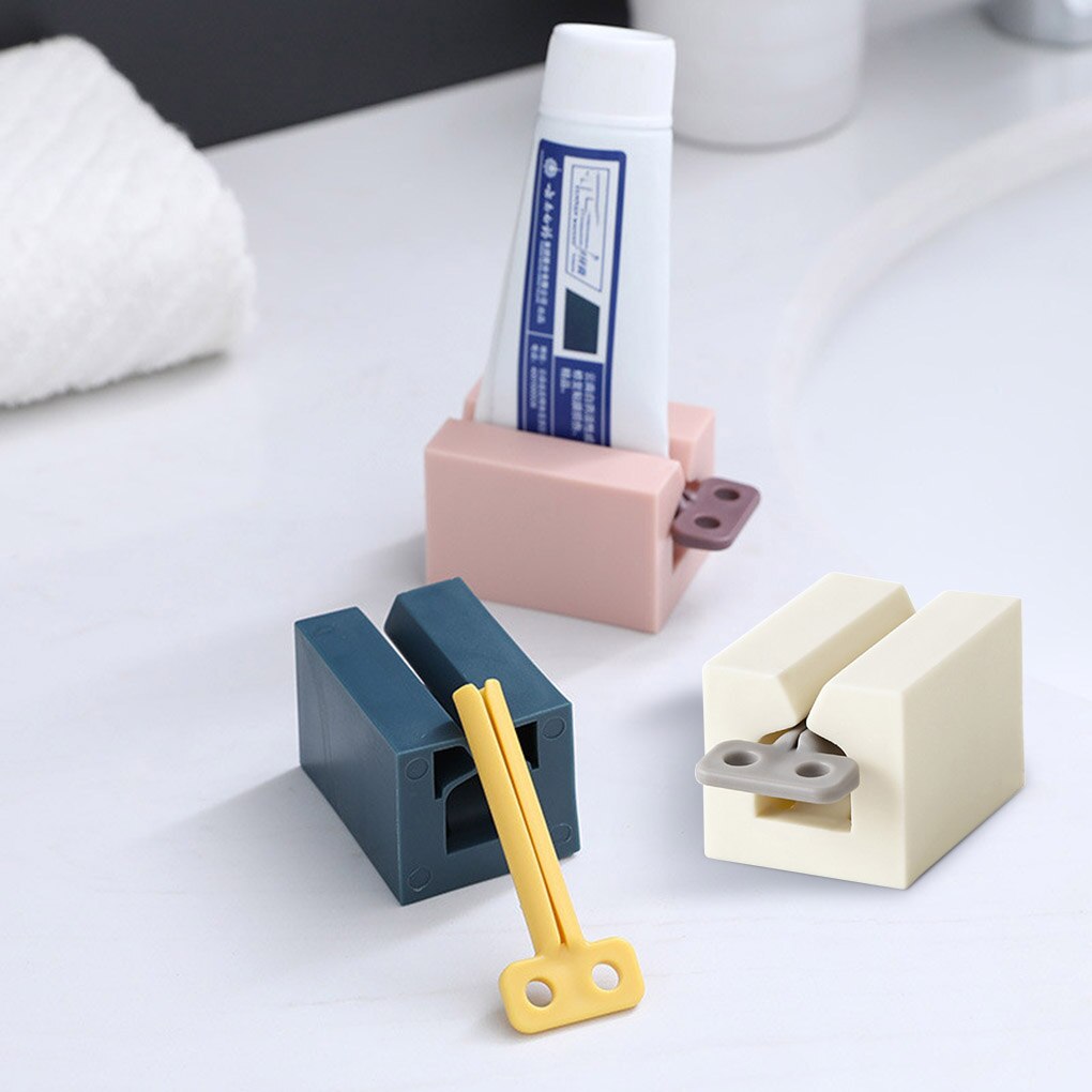 Nouveaux accessoires de salle de bain presse-dentifrice distributeur de pâte à dents presse-Tube nettoyant pour le visage presse support roulant pour enfants