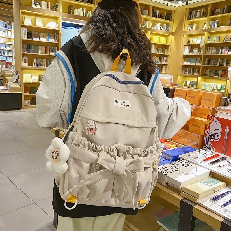 Mochila de estilo coreano para mujer, morral escolar Kawaii de gran capacidad con bolsillos abiertos y lazo, morral de viaje para adolescentes y niñas