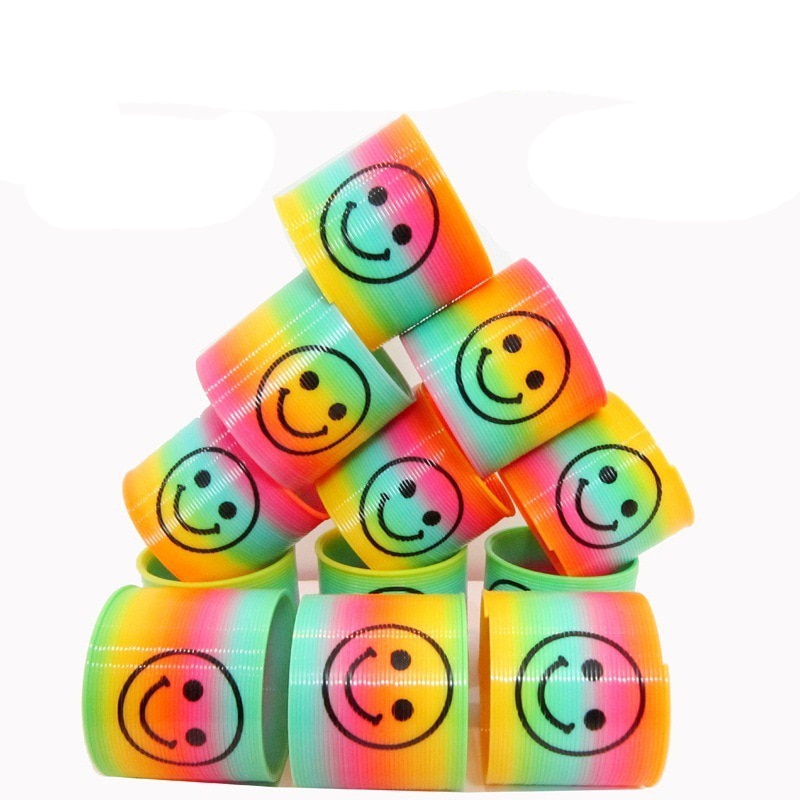 10 pz/impostato anti-fatica Magia di Sorriso di Plastica Arcobaleno Primavera Cerchio Colorato Bobina Elastico Anello di Giocattoli Educativi per I Giochi per Bambini