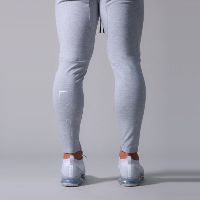 Pants men's jogging fitness track pants men's Korean casual slim hit color jogging trousers