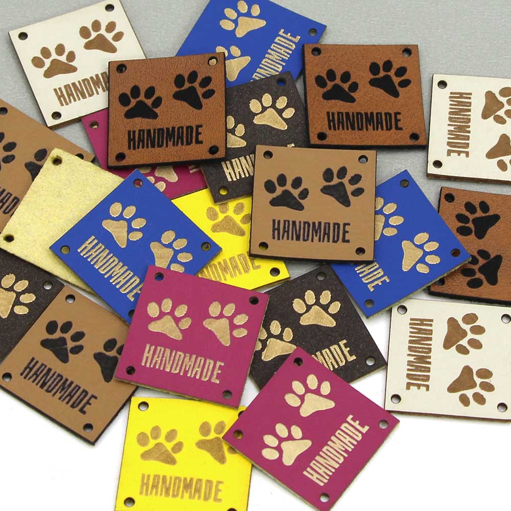Etiquetas de cuero con huellas de animales, etiquetas hechas a mano para ropa, perro, gato, oso, pata, etiqueta hecha a mano para coser sombreros DIY, 20 piezas, 25x25mm