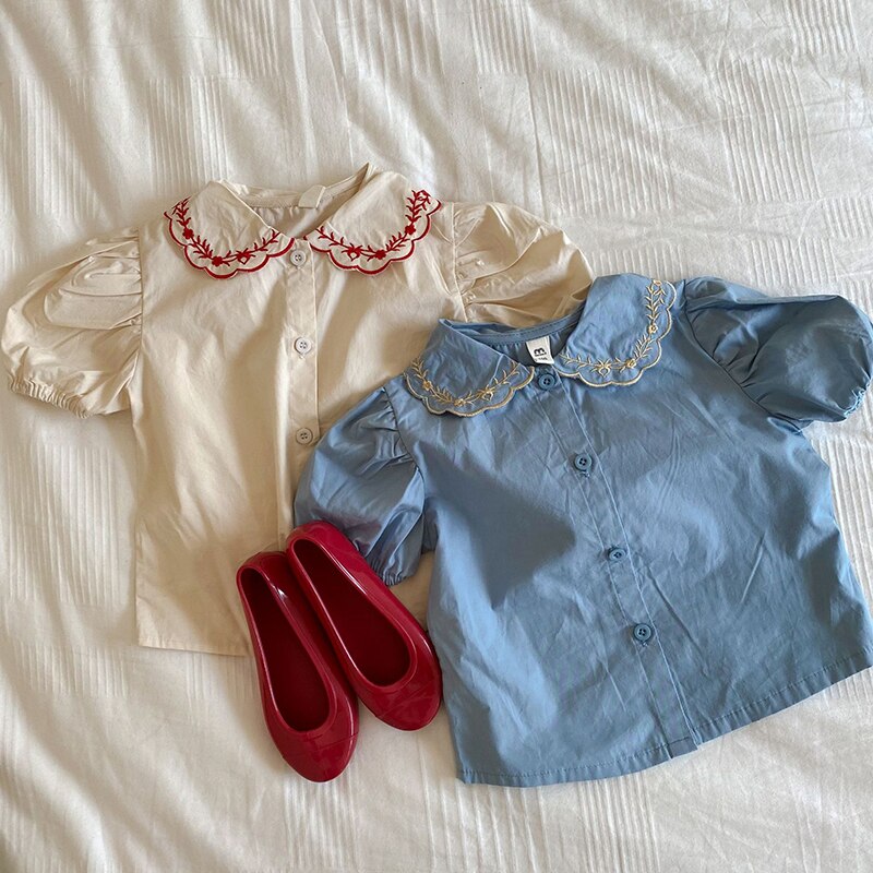 Camicetta per bambina estiva camicia per bambini camicetta per bambini abiti di moda per bambini Ins manica a sbuffo colletto ricamato cotone 1-6Y