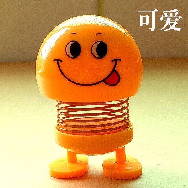 Śmieszne słodkie lalki twarzy pouruszająca głową lalka w samochodzie kreatywny samochód słodkie ozdoby wiosenne wyrażenie: cute