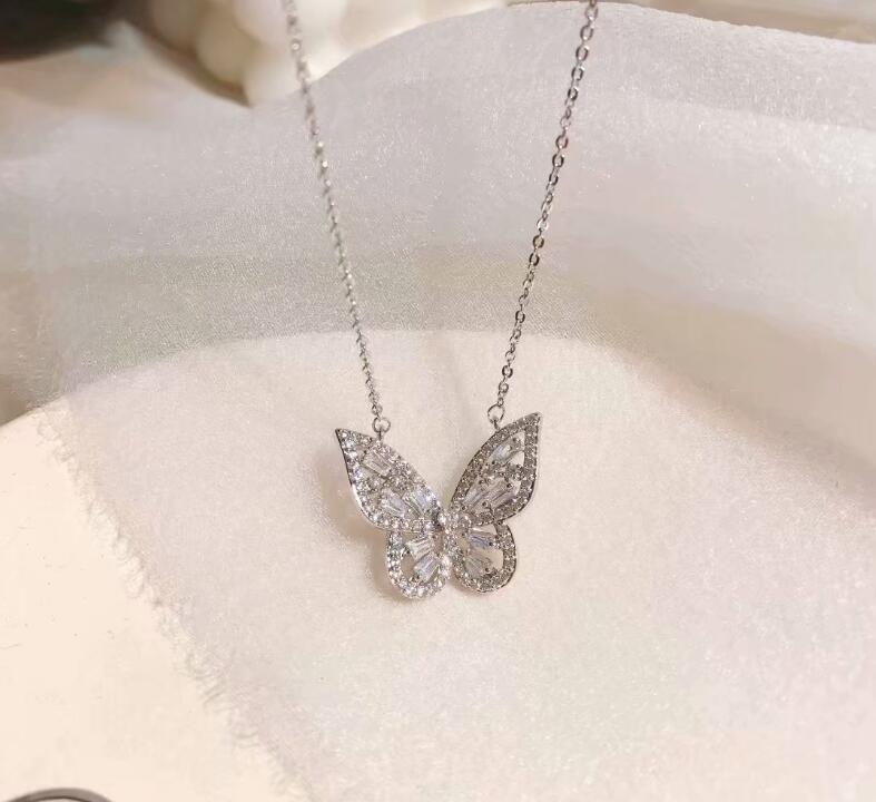 Femmes de luxe à la brillant strass boucle d'oreille gemme papillon anneau collier ensemble de bijoux: necklace