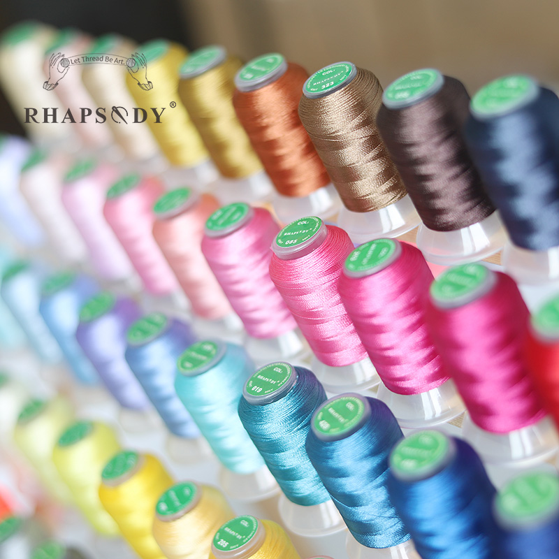Rhapsodie 40WT Polyester-Stickmaschinengarn 550 Jahre 60 Farben Bruder Babylock Janome Sänger Pfaff Husqvarna Bernina NäHenne