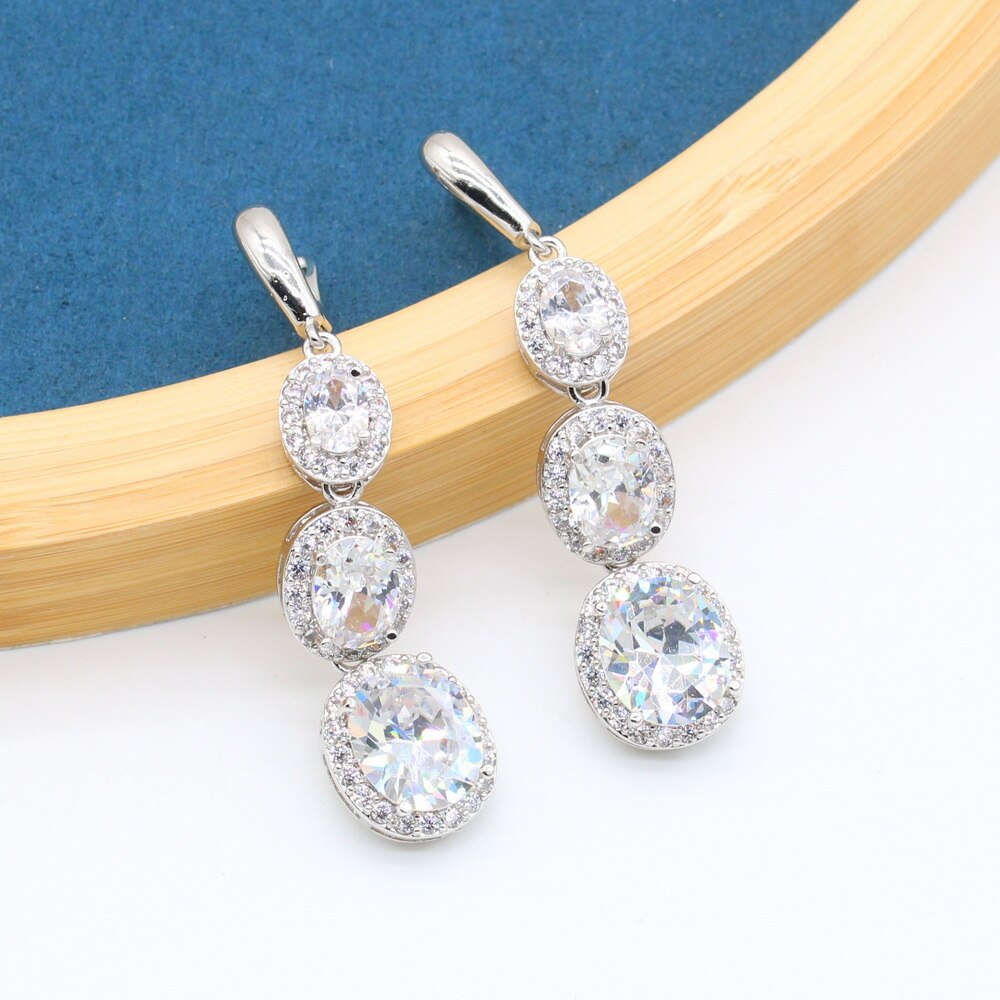 Set di gioielli classici Color argento con zirconi bianchi per bracciale da donna orecchini lunghi collana con ciondolo anello regalo