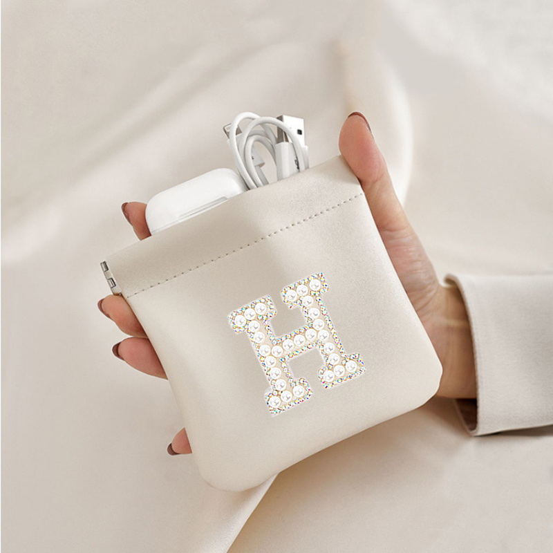 Pearl letter sticker PU bullet storage bag, earphone lipstick, change, makeup bag, fashionable and exquisite mini bag