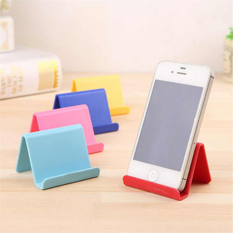 Soporte para teléfono móvil Candy Mini, soporte fijo portátil, suministros para el hogar, plástico, Color aleatorio, 6*4,5 cm