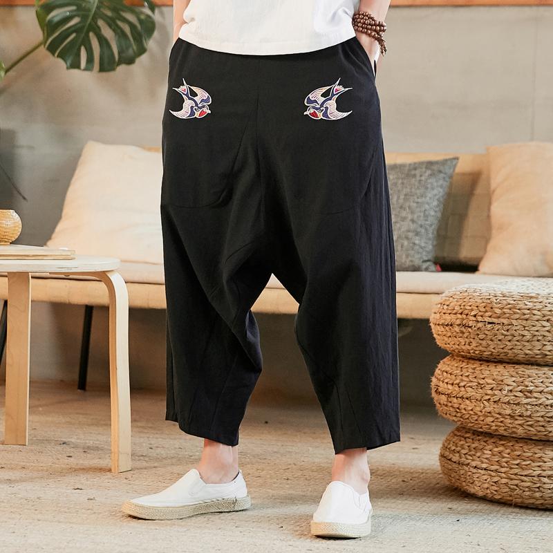 5xl herre bukser i skridtet sommer baggy hørbukser plus størrelse mandlige elastik talje swarrow print vilde ben cross bukser xxxxxl: Sorte crossbukser / M