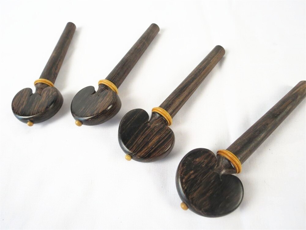 Een set van cello pinnen natuurlijke zwarte palissander muziekinstrument deel