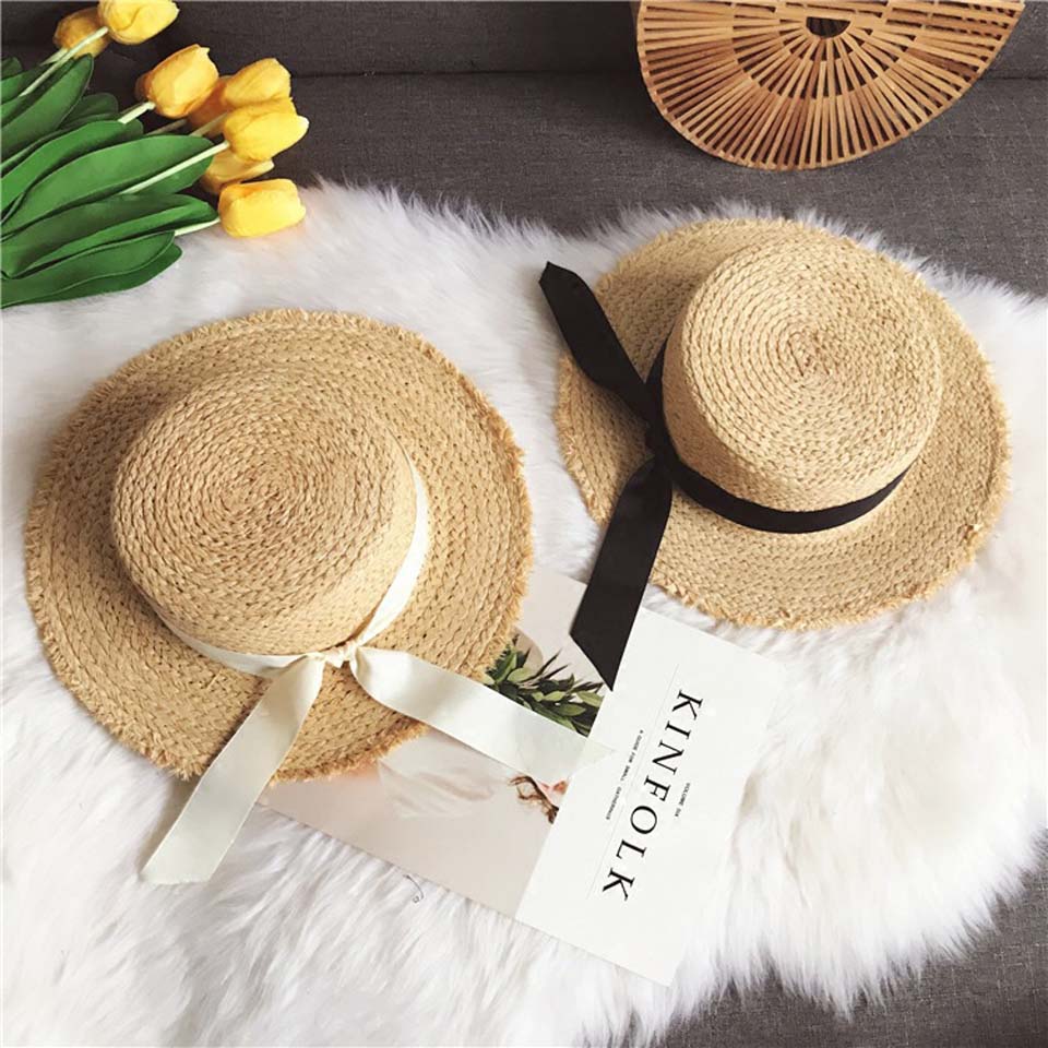 Kvinnor sommar strand raffia solhatt med band rosett raffiahatt temperament platta stråhattar dam båtägare solhatt raffia solhatt