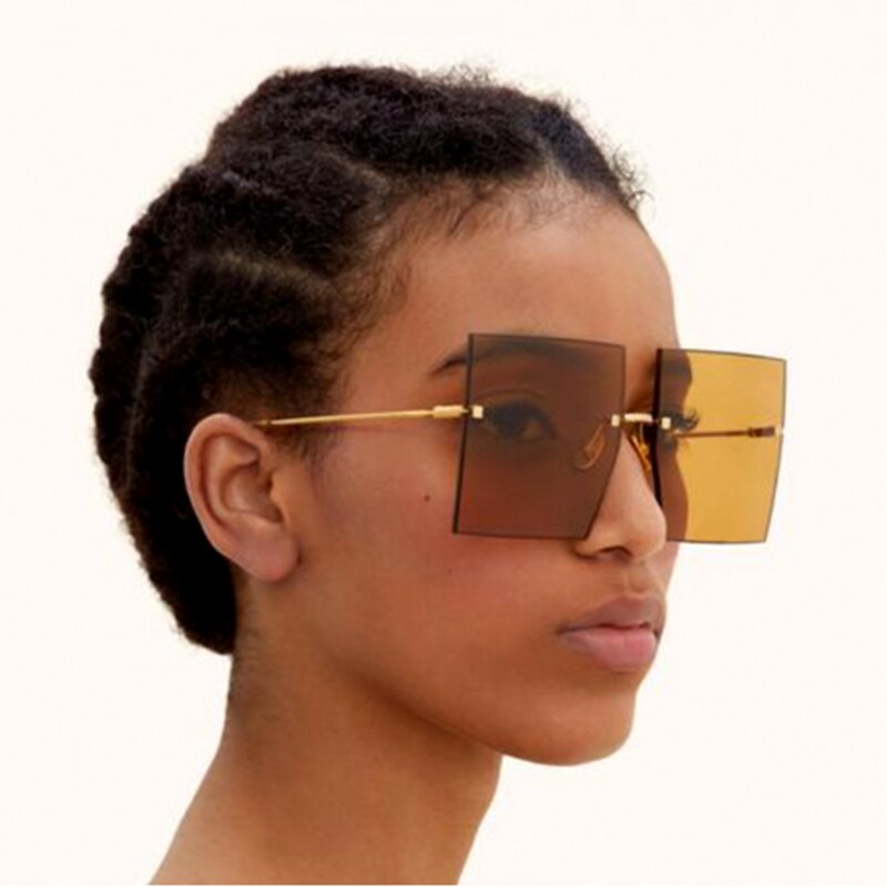 Gafas de sol europeas y americanas grandes cuadradas sin marco recortadas celebridades con el mismo estilo de la cubierta de tiro de calle de