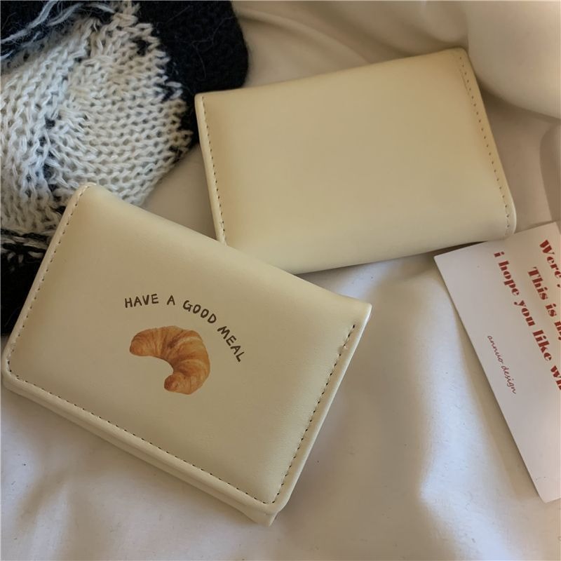 Nueva billetera para tostadas de mantequilla, billetera corta de color amarillo leche, versión coreana, monedero de estudiante de dibujos animados para mujer, monedero de almacenamiento de llaves