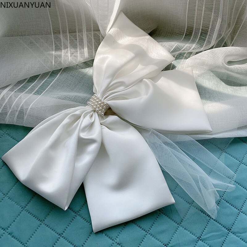 Witte minimalistische witte oversized strik haarspeld sluier die bruidshoofdtooi bedekt bruiloft accessoires