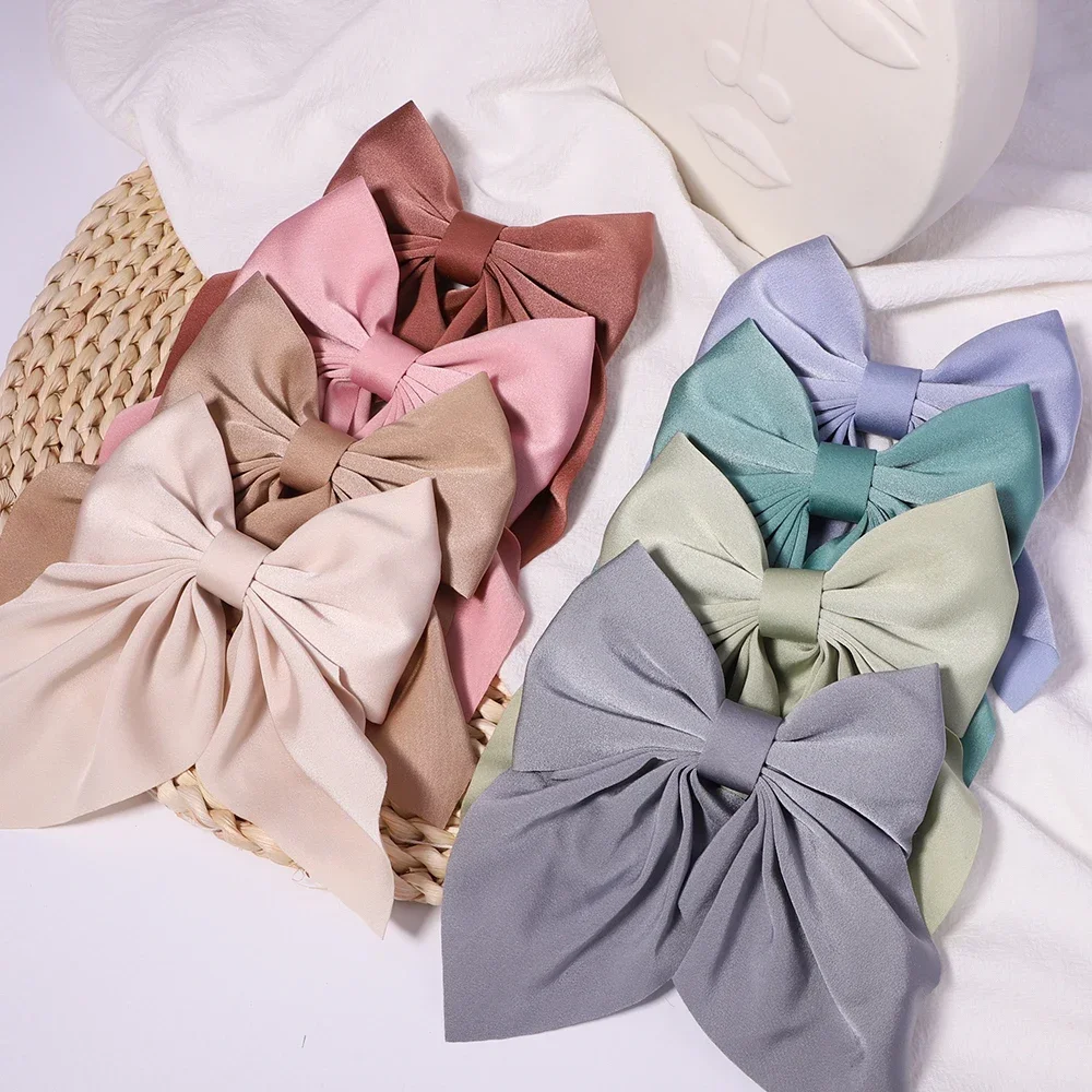 Suloiset rusettipinnit, yksivärinen rusettisolmu, tytöille tarkoitetut satiiniperhospidokset, ankannokkiset hiuspinni lasten hiusasusteet