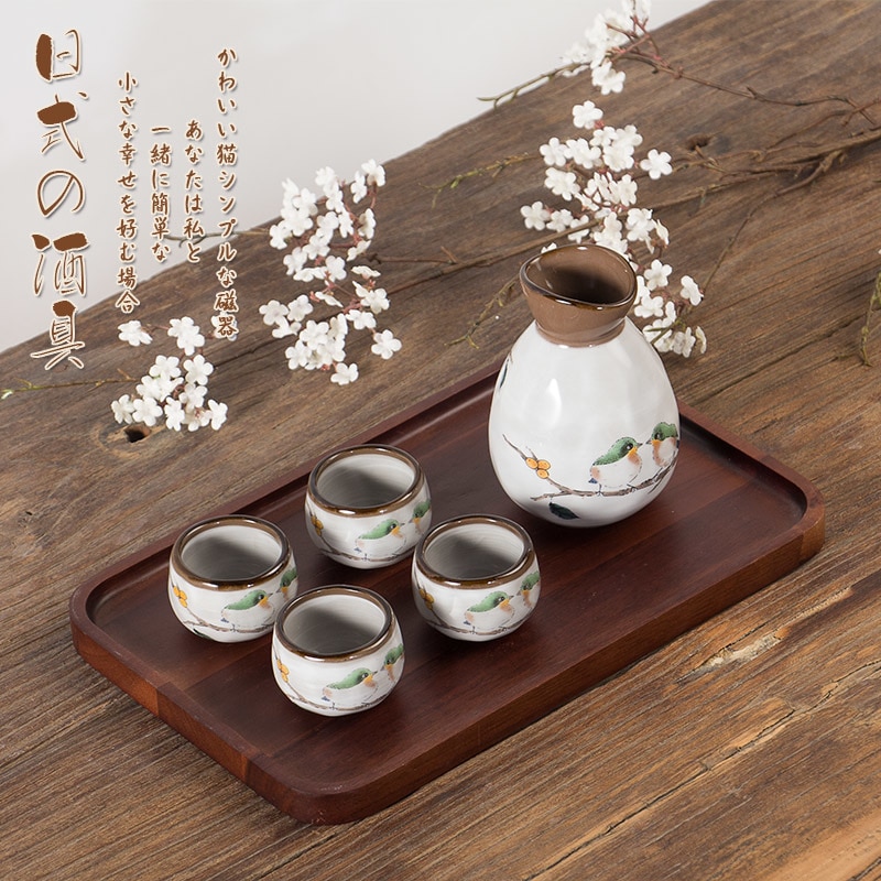 Japanilaistyylinen viinisarja viina sake valkoinen keltainen viinipannu neljä keraamista kuppia korkean lämpötilan annostelija viina viinikulho
