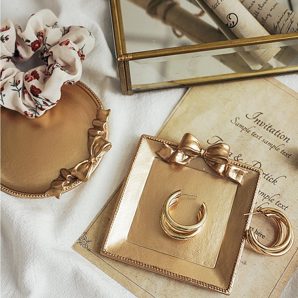 Retro still life photography, photo studio prop, golden vintage plate, dish with bow knot for jewelry, earrings, photography