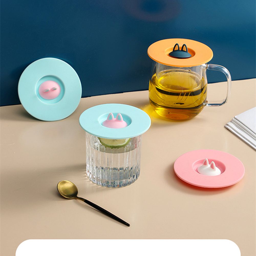 Durable, non-toxic, reusable coffee mug with sealed cover and anti-scalding suction cup lid.