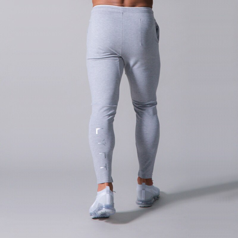 Pants men's jogging fitness track pants men's Korean casual slim hit color jogging trousers: M / Gray