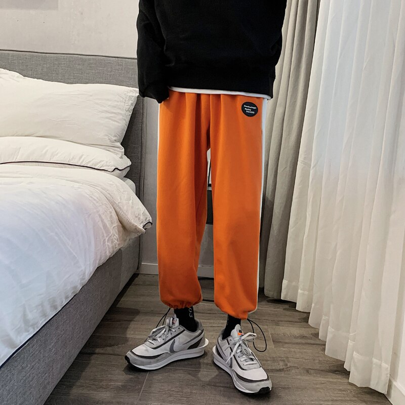 Verkkarit miesten hittivärit rento lenkkeilyhousut miesten katuvaatteet villi löysät hip hop suorat housut miesten verryttelyhousut: M / Oranssi