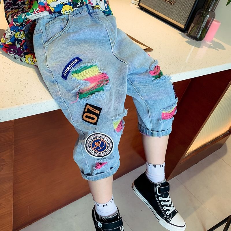 Pantalones vaqueros rasgados para niños y niñas de 2 a 12 años, sección delgada, ropa exterior juvenil, pantalones recortados de Graffiti, novedad de verano