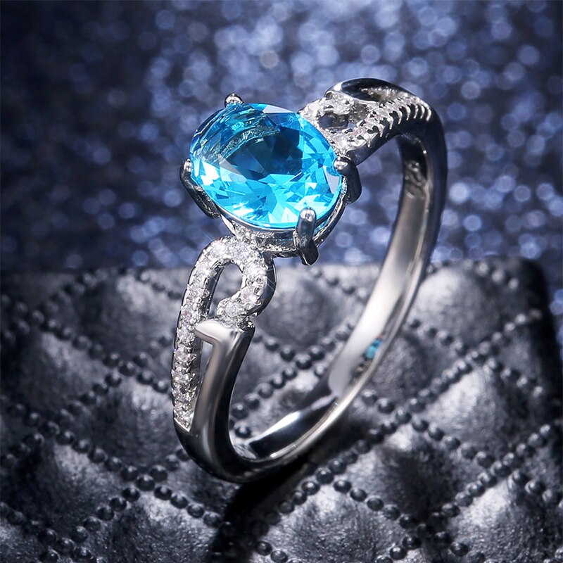 Huitan-anillo de compromiso clásico con piedras ovaladas para mujer, joyería de lujo con Micro incrustaciones de nubes, color azul cielo, CZ: 6
